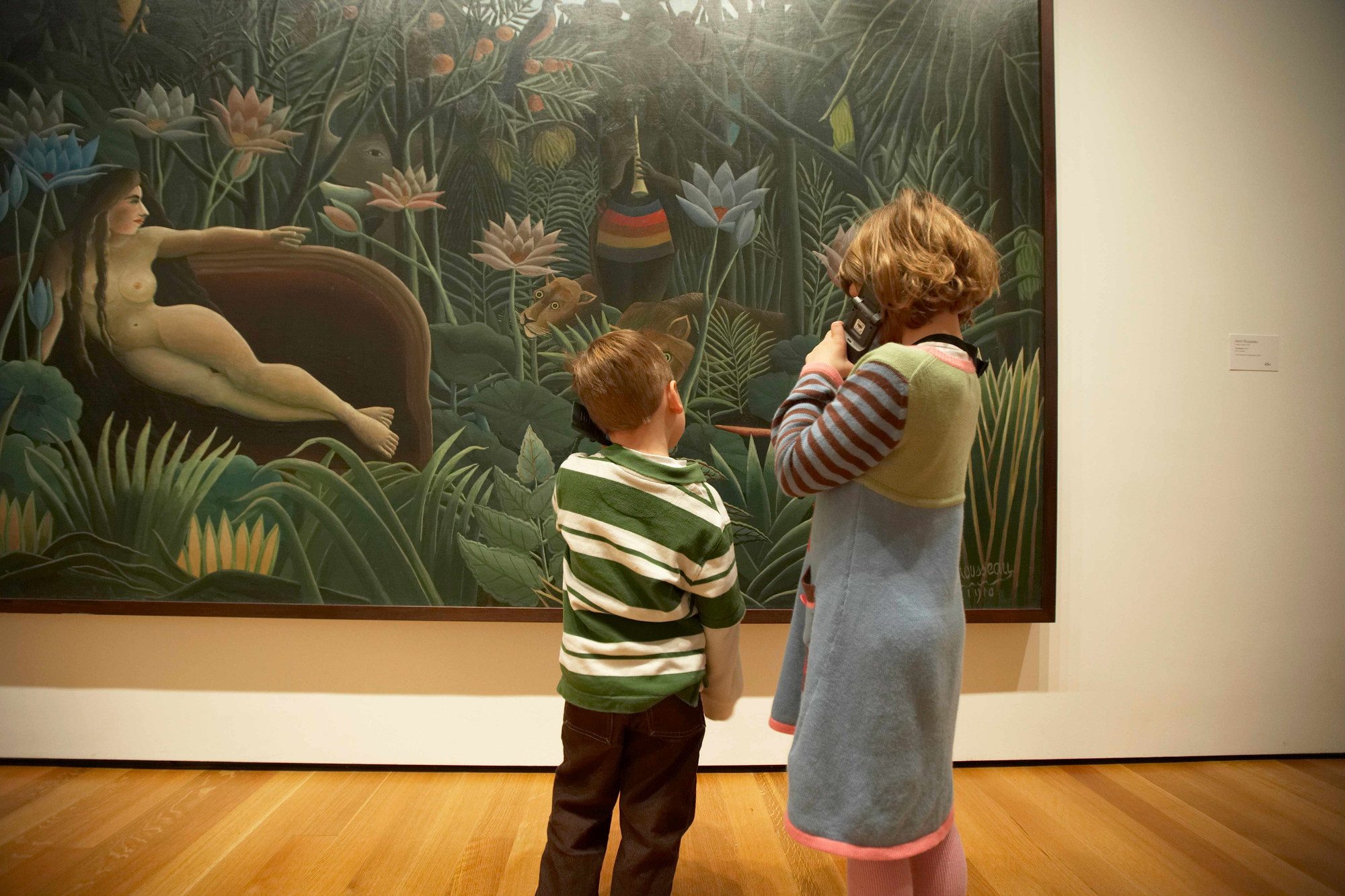 Children listening to MoMA Audio for Henri Rousseau’s The Dream. 1910. Oil on canvas. Gift of Nelson A. Rockefeller. © Museum of Modern Art, N.Y. Photo: Jason Brownrigg