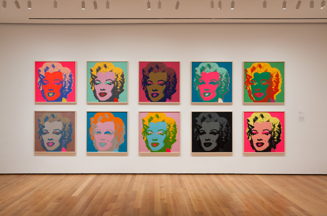 Installation view of Andy Warhol: Campbell's Soup Cans and Other Works, 1953–1967 at The Museum of Modern Art, April 25–October 12, 2015. Photo: Jonathan Muzikar. © 2015 The Museum of Modern Art, New York. Shown:  Andy Warhol. Marilyn Monroe. 1967. Portfolio of 10 screenprints, each composition and sheet: 36 x 36″ (91.5 x 91.5 cm). The Museum of Modern Art. Publisher: Factory Additions, New York. Printer: Aetna Silkscreen Products Inc., New York. Edition: 250. The Museum of Modern Art, New York. Gift of Mr. David Whitney, 1968. © 2015 Andy Warhol Foundation for the Visual Arts/Artists Rights Society (ARS), New York