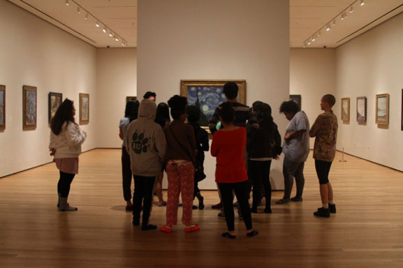 Looking at The Starry Night in our pajamas. Photo: Kaitlyn Stubbs. Shown: Vincent van Gogh. The Starry Night. Saint Rémy, June 1889. Oil on canvas, 29 x 36 1/4" (73.7 x 92.1 cm). Acquired through the Lillie P. Bliss Bequest
