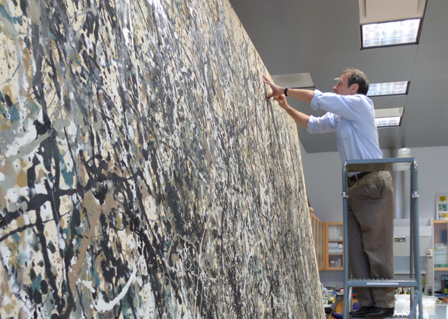 Conservator Jim Coddington beginning conservation treatment of Jackson Pollock's One: Number 31, 1950