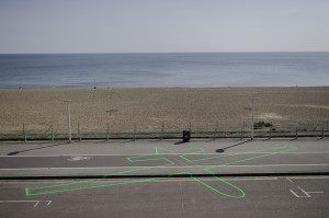 James Bridle (British, b. 1980) and Einar Sneve Martinussen (Norwegian, b. 1982). Drone Shadow 003, Brighton, UK. 2013. Road-marking paint. 66’ x 36’ (20 x 11m). Image courtesy of Roberta Mataityte/Lighthouse. Photo by James Bridle
