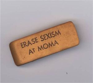 Eraser stamped with the text ERASE SEXISM AT MOMA