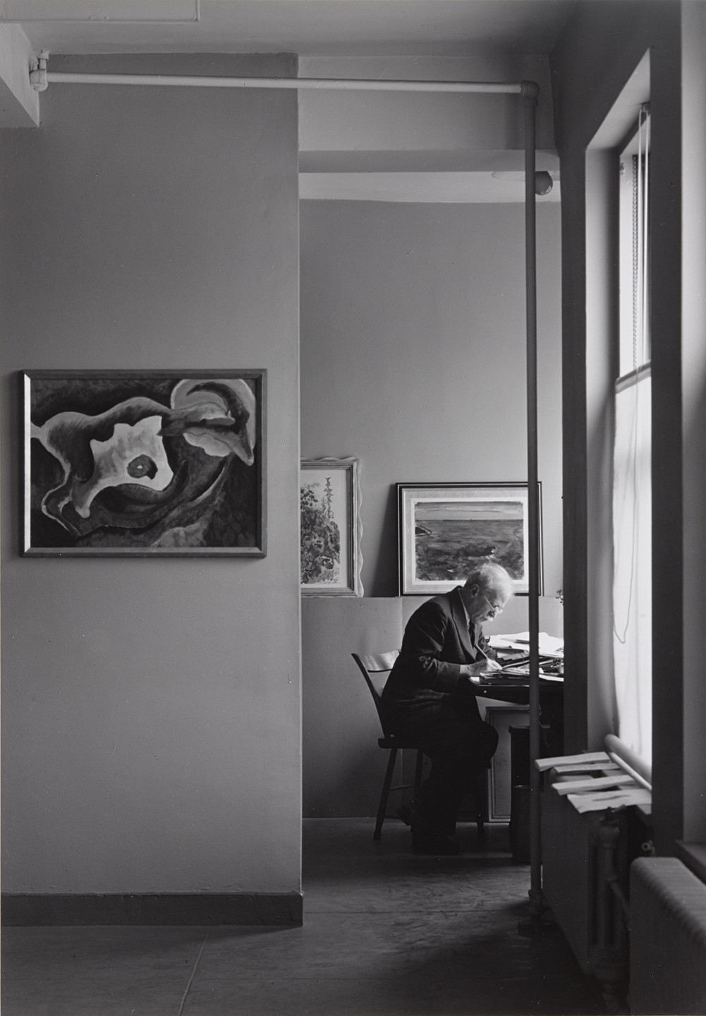 Ansel Adams. Alfred Stieglitz at his desk at An American Place. 1938