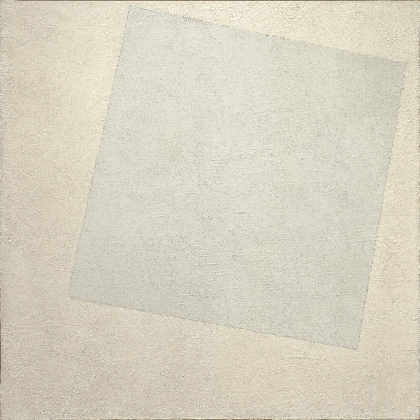 A large, light gray, irregular quadrilateral is tilted and appears to overlap a beige, textured background. The combination of shapes and muted colors creates a subtle contrast. This is an AI generated description. To give feedback, email ai@moma.org.