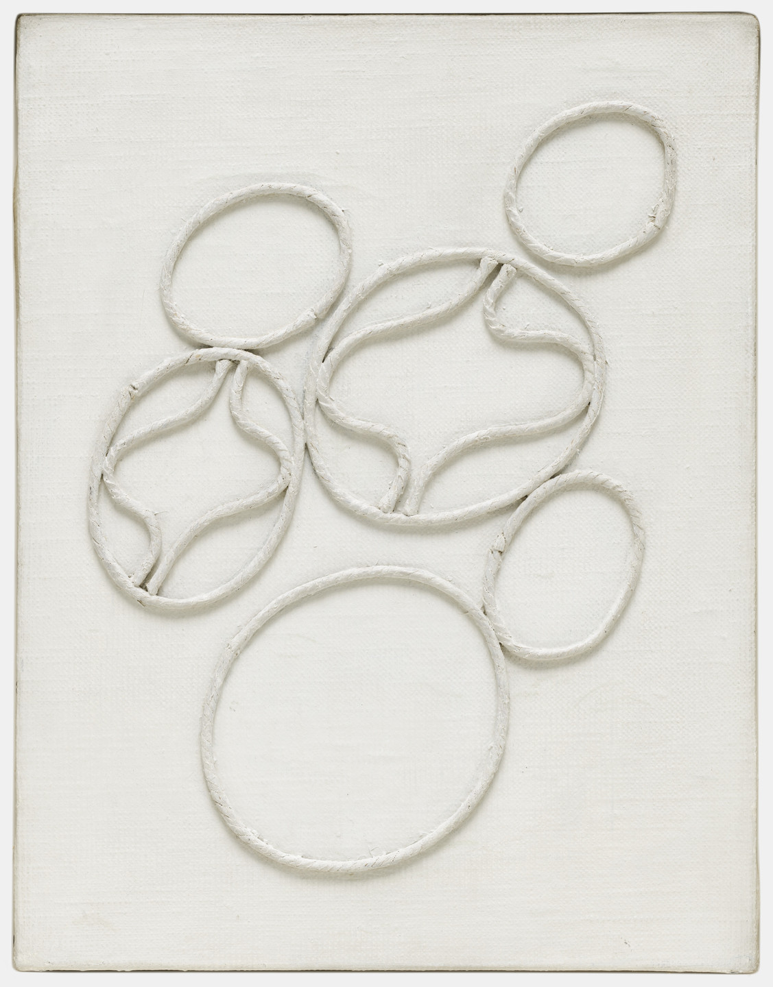 The artwork features interconnected, raised circular and oval shapes on an off-white canvas. The predominant color is off-white, and the shapes are textured and three-dimensional. This is an AI generated description. To give feedback, email ai@moma.org.