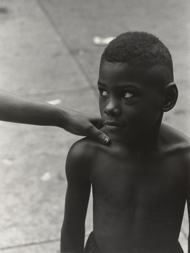 Boy, Woman's Hand on Shoulder