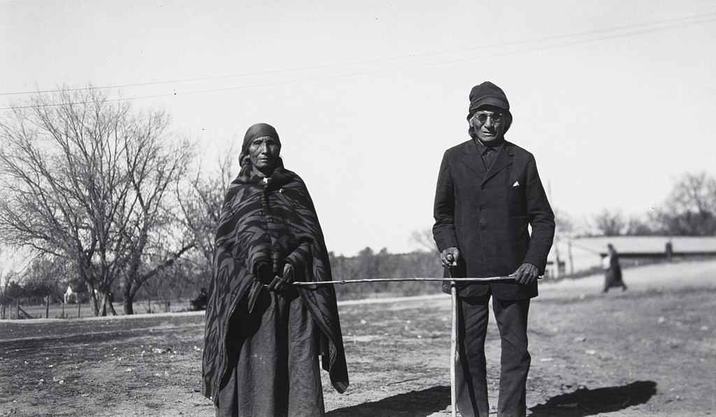Mrs. Running Horse Leading Her Blind Husband