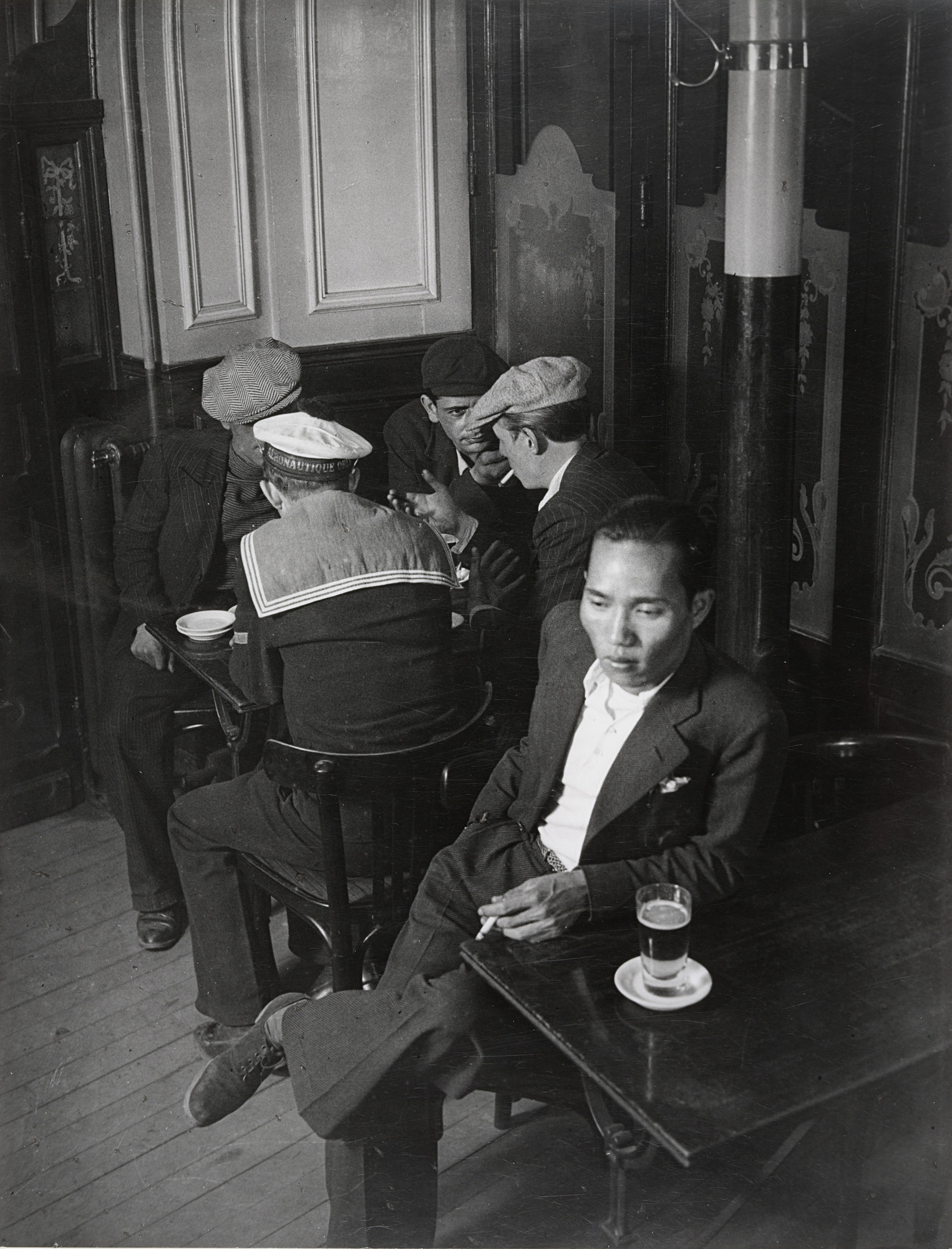 Brassaï (Gyula Halász). The Chinaman and Young Toughs in a Bistro near the Place d'Italie