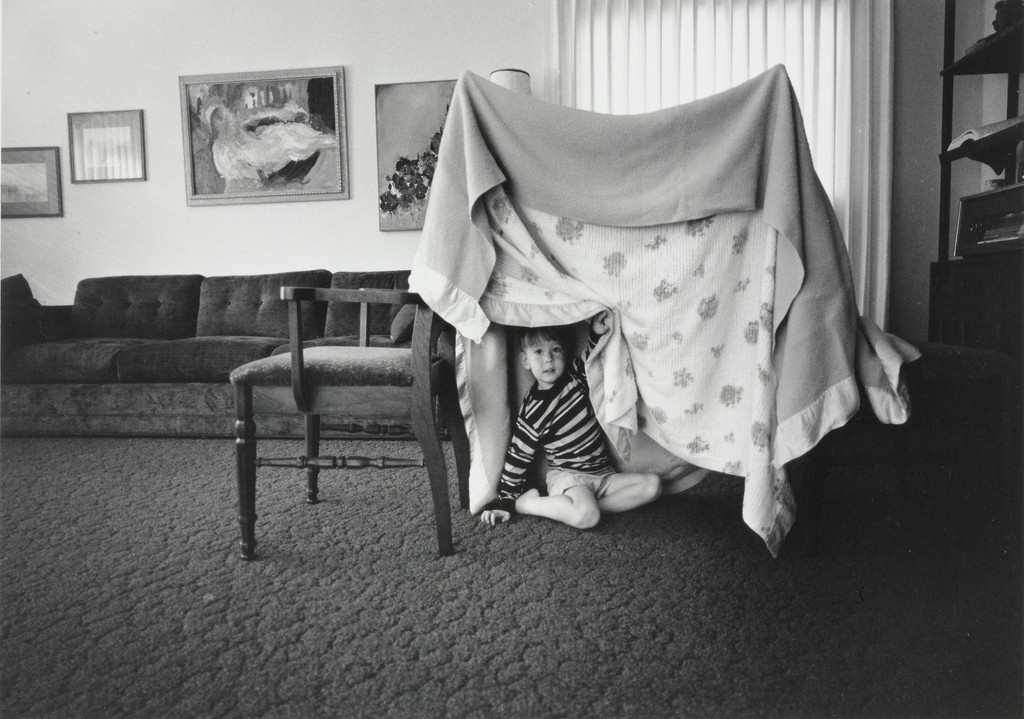 Some days when there is no one to play with I build Glenn a tent play house out of two chairs and two blankets.