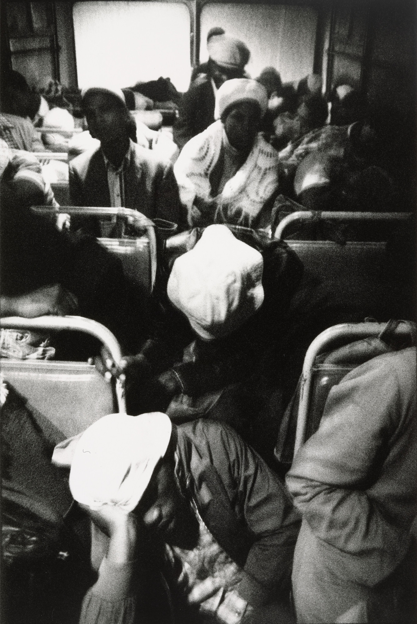 David Goldblatt. The Transported of Kwa Ndebele: Going to Work - 3:30am Wolwekraal-Marabastad Bus, Standing Passengers Have Slumped to the Floor
