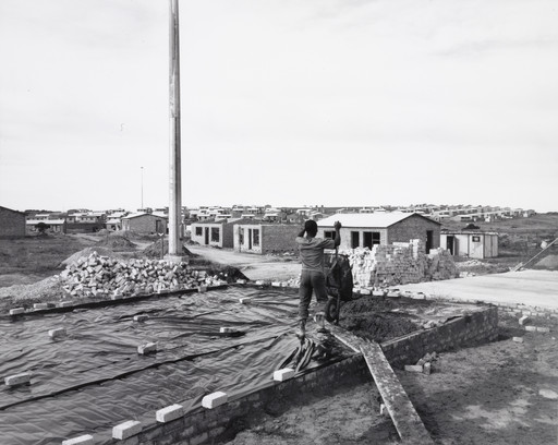 David Goldblatt. A Man Building His House on His Own Plot of Ground, Marselle Township, Kenton-on-Sea, Eastern Cape. 8 July 1990