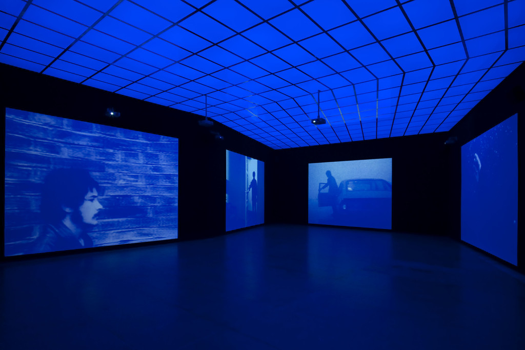 It's late and the wind carries a faint sound as it moves through the trees. It could be anything. The jingling of little bells perhaps, or the tiny flickering out of tiny lives. I stroll down the sidewalk and close my eyes and open them and wait for my, mind to go perfectly blank. Like a room no one has ever entered, a room without any doors or windows. A place where nothing happens.