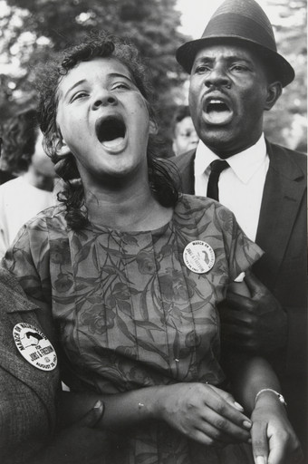 Washington, D.C.: Demonstrators sing "We Shall Overcome" after Dr. Martin Luther King, Jr.'s "I Have a Dream" speech