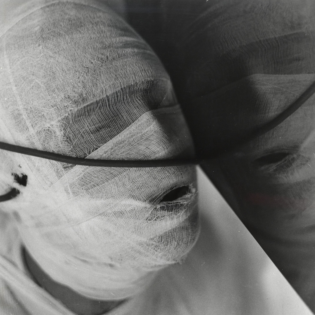 6th Action, (gauzed face and reflection)