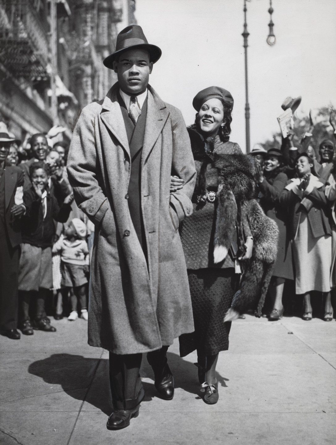 Times Wide World Photos. Mr. and Mrs. Joe Louis Out for a Stroll. September 25, 1935