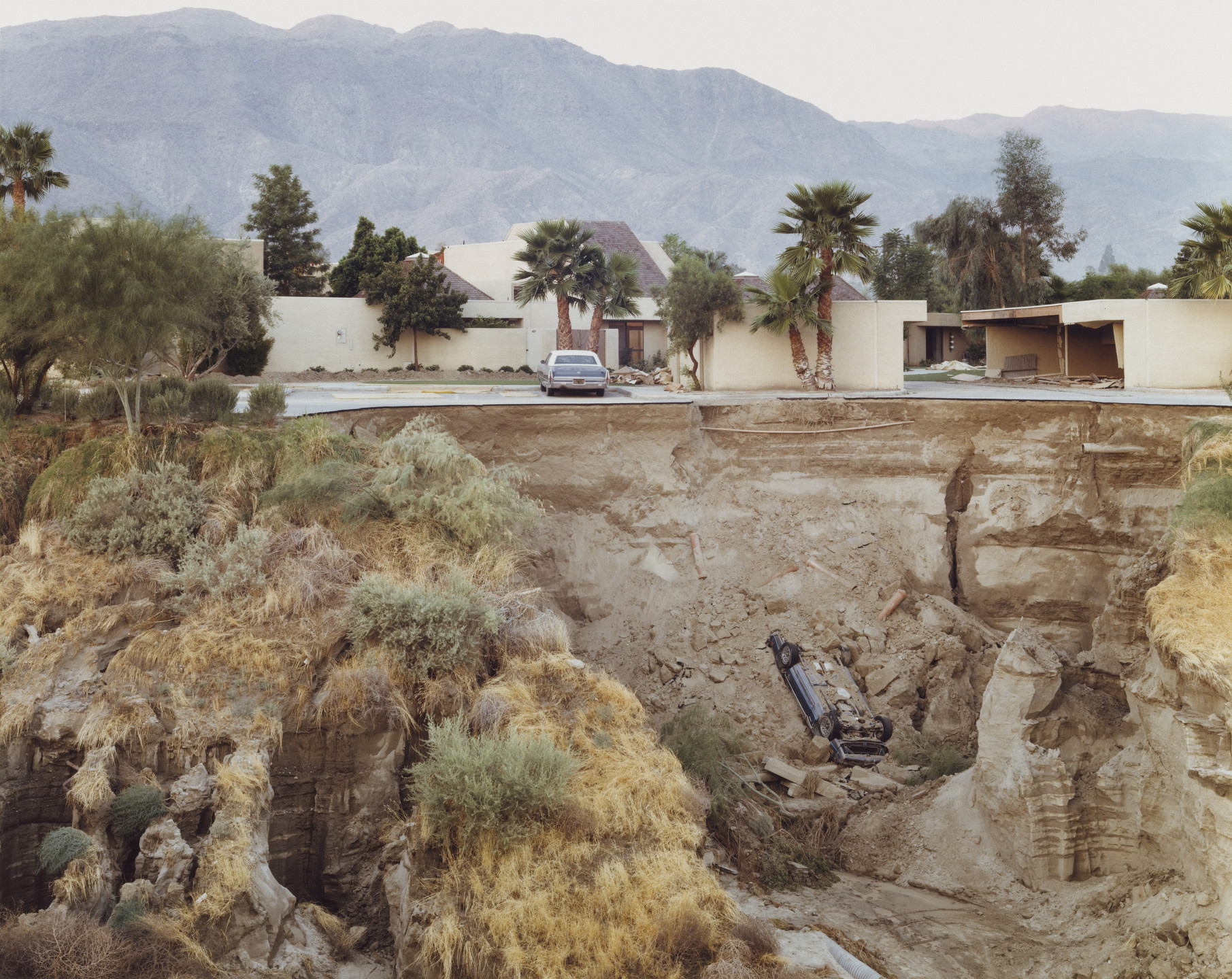 Joel Sternfeld. After a Flash Flood, Rancho Mirage, California. July 1979