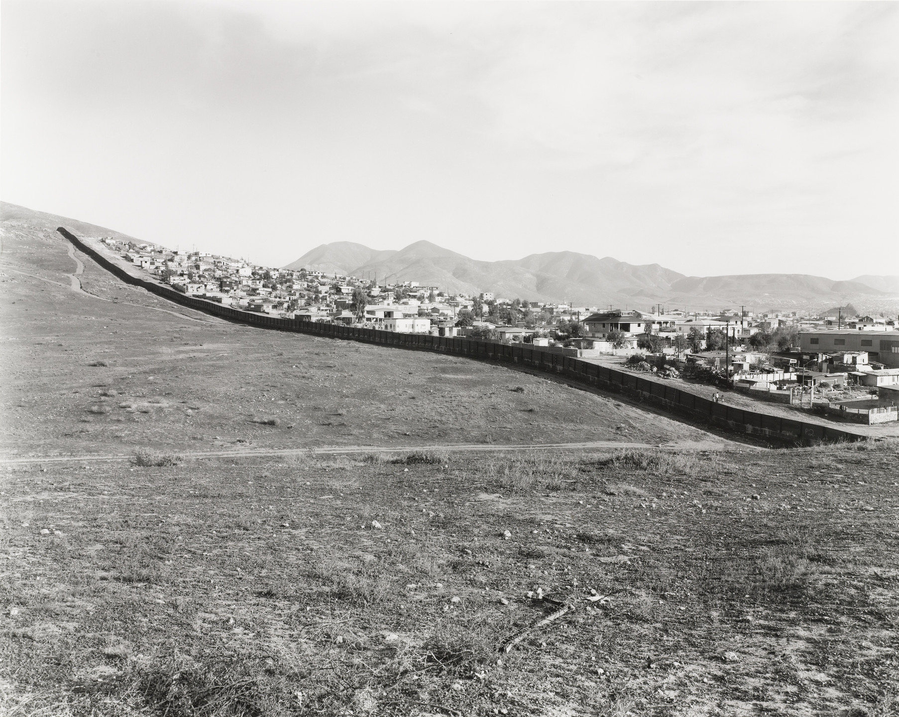 Geoffrey James. Looking Towards Mexico, Otay Mesa, from the series Running Fence. 1997