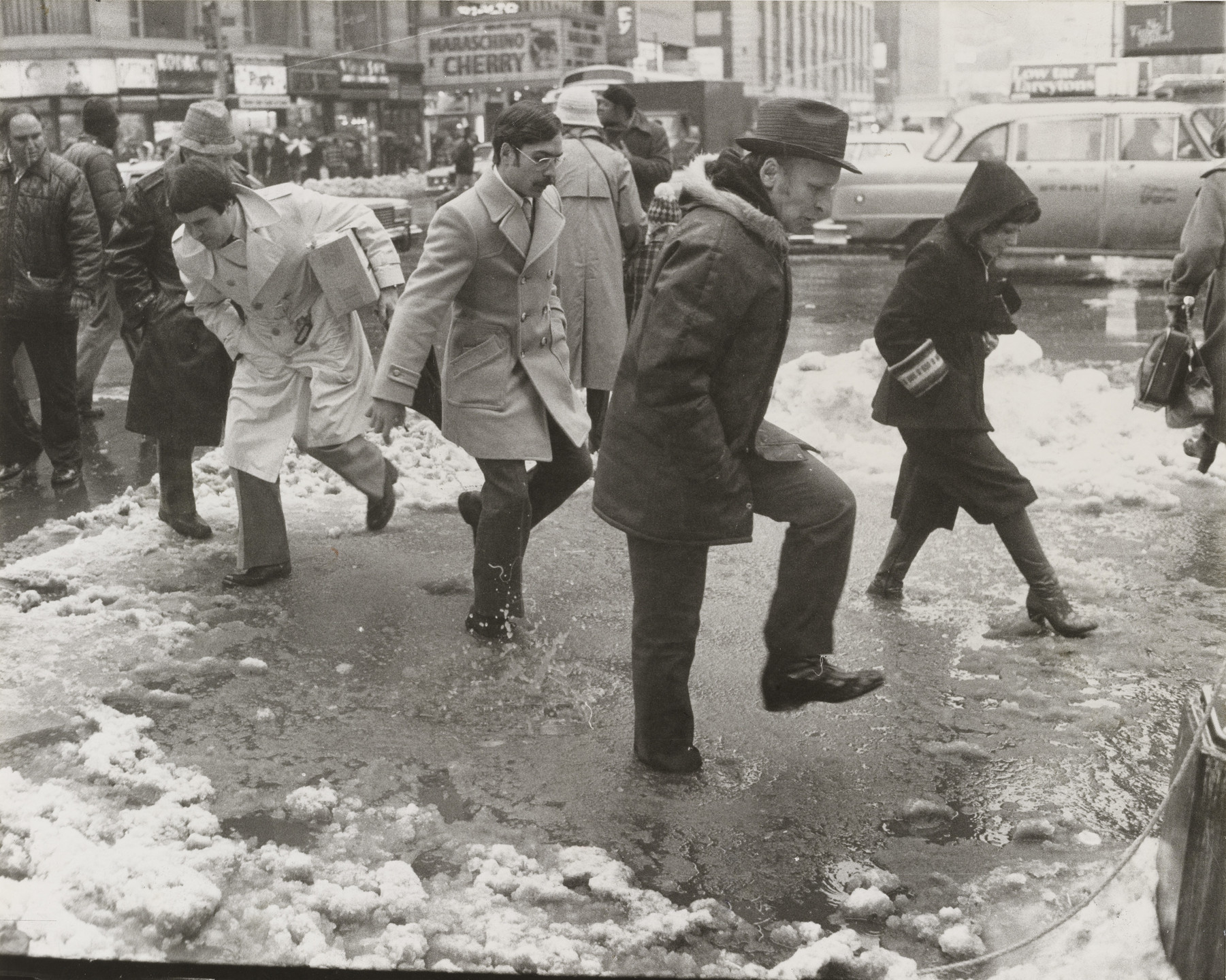 Barney Ingoglia/The New York Times. Rain Raises Fears of Flooding: Pedestrians in Times Square. January 25, 1978