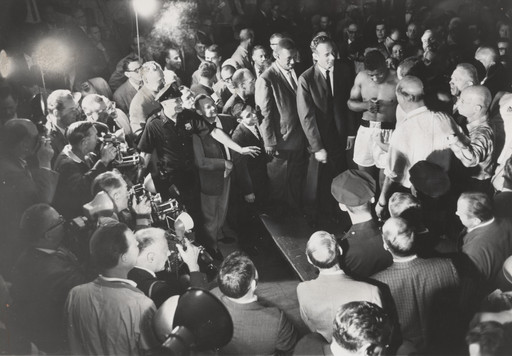 Crowd Presses Around Floyd Patterson as the Heavy Weight Champion Pauses During Examination at Commodore