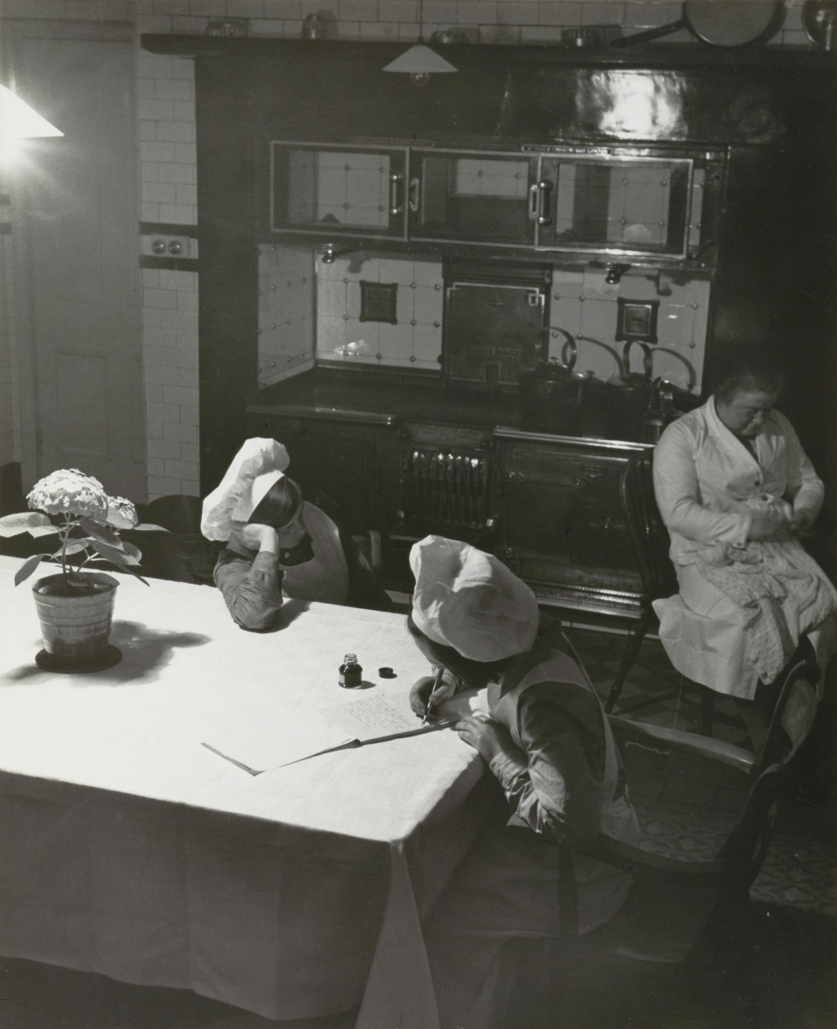 Bill Brandt. Late Evening in the Kitchen. c. 1937