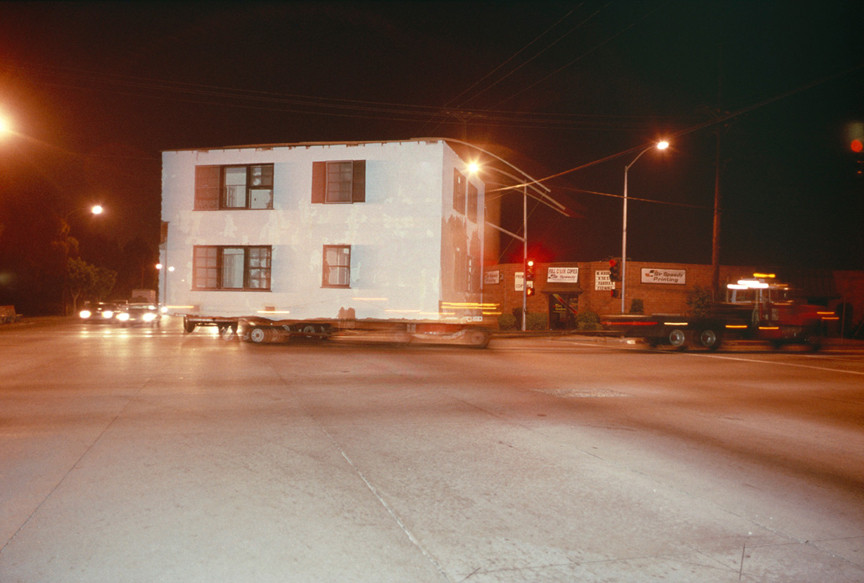 Allan Sekula. Shipyard-workers&#39; housing--built during the Second World War--being moved from San Pedro to South-Central Los Angeles from the series Fish Story. May 1990