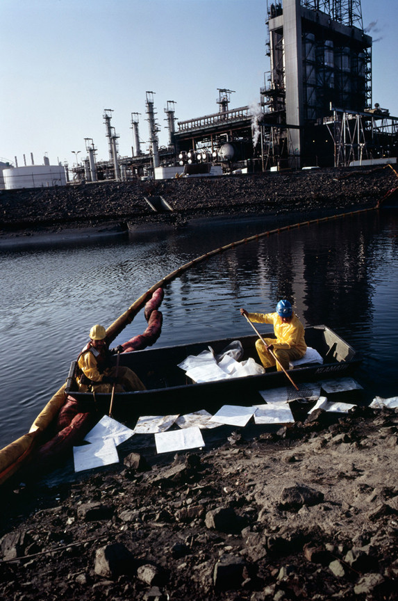 Allan Sekula. Workers cleaning up chemical spill after refinery explosion. Los Angeles harbor. Wilmington, California from the series Fish Story. October 1992