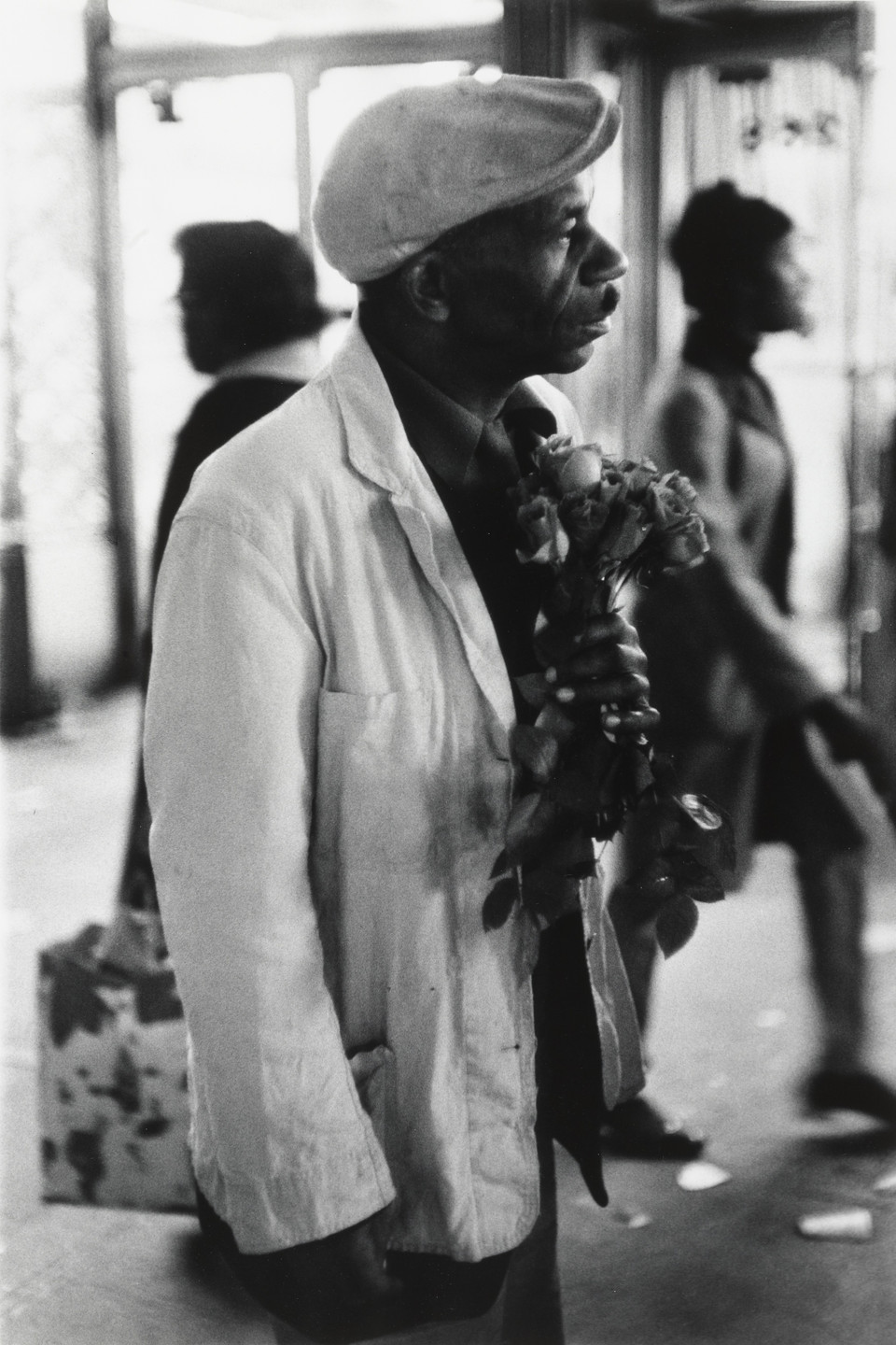 Beuford Smith. Man with Roses, 125th. St. NYC. 1968