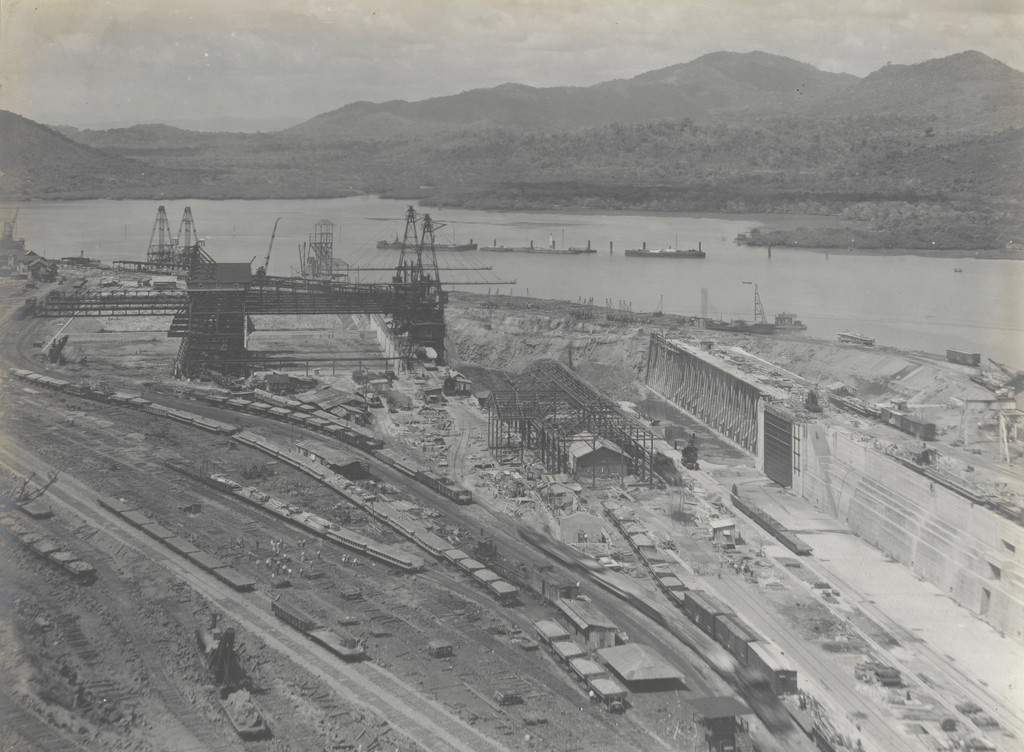 Balboa Terminals. Dry Dock #1. General view from Sosa Hill. Steel erected for building #29. Pumping Plant and Air Compressor Ho. Panama R.R. tracks in permanent location in foreground. Central part of Cofferdam drilled, & drills removed ready for blasting