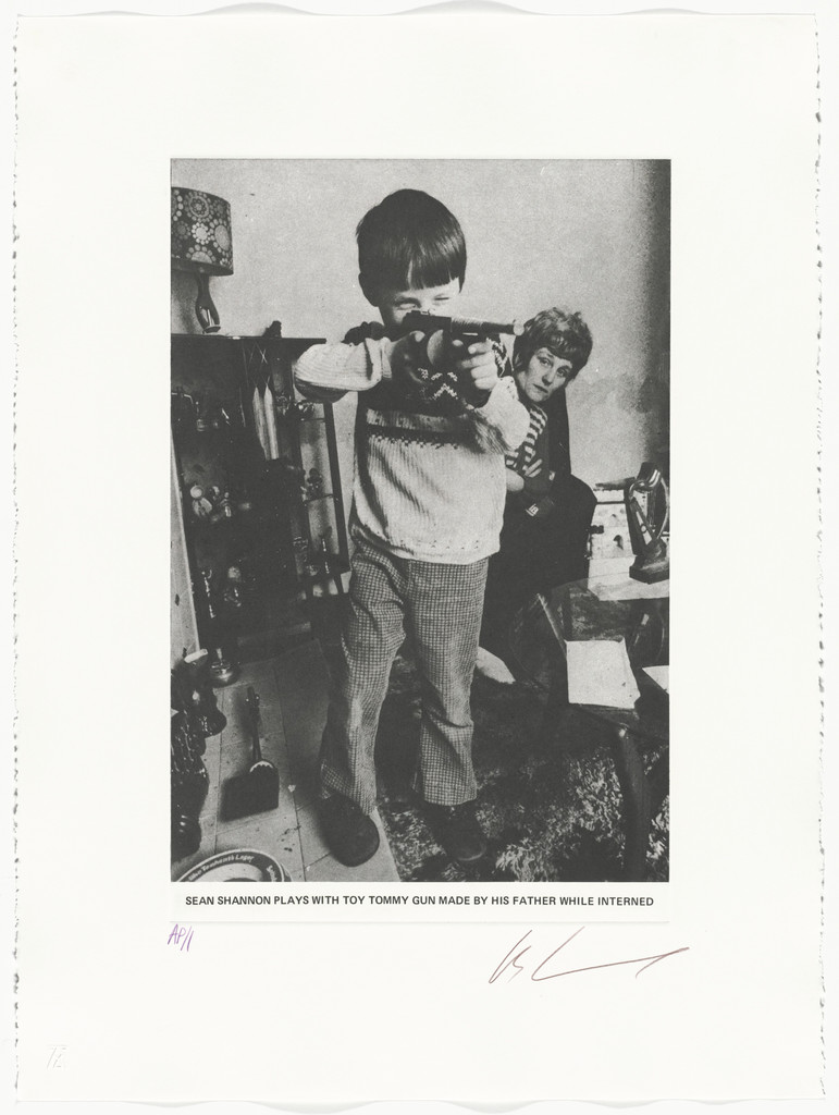 Sean Shannon Plays with Toy Tommy Gun Made by His Father While Interned from the series The Troubles, Les Levine, 1977
