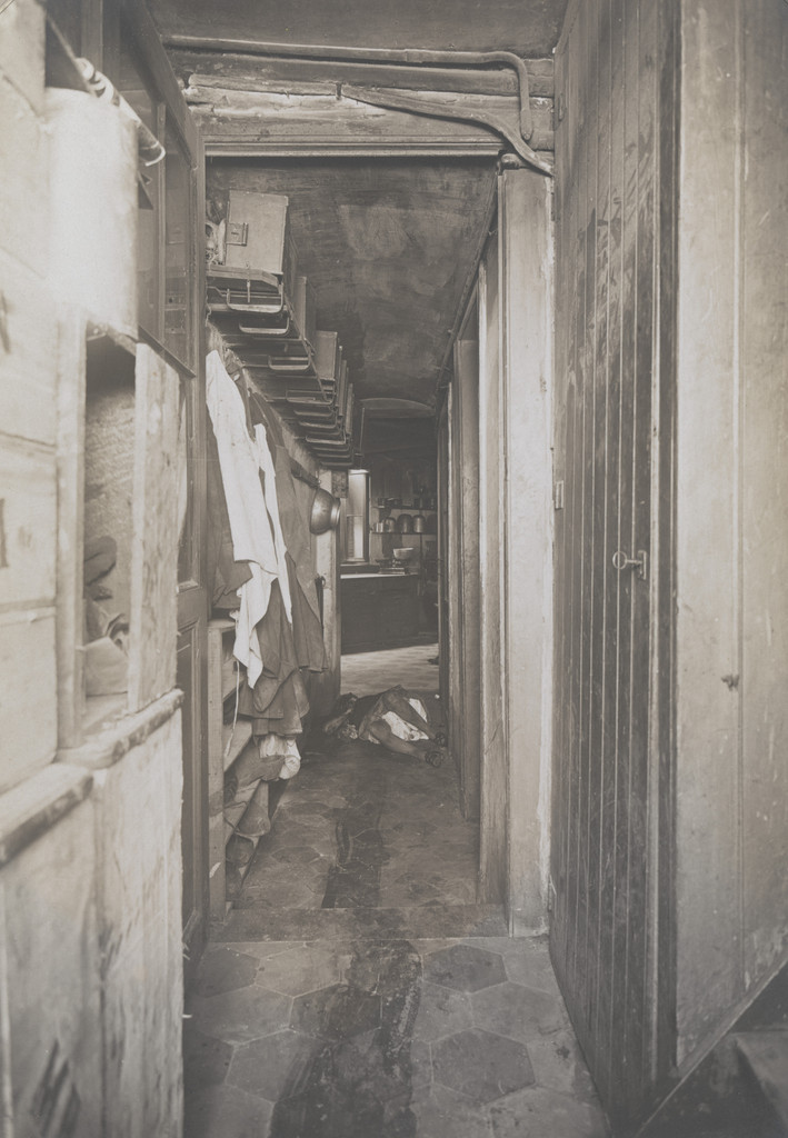 Untitled (crime scene: view down hall with body at end)