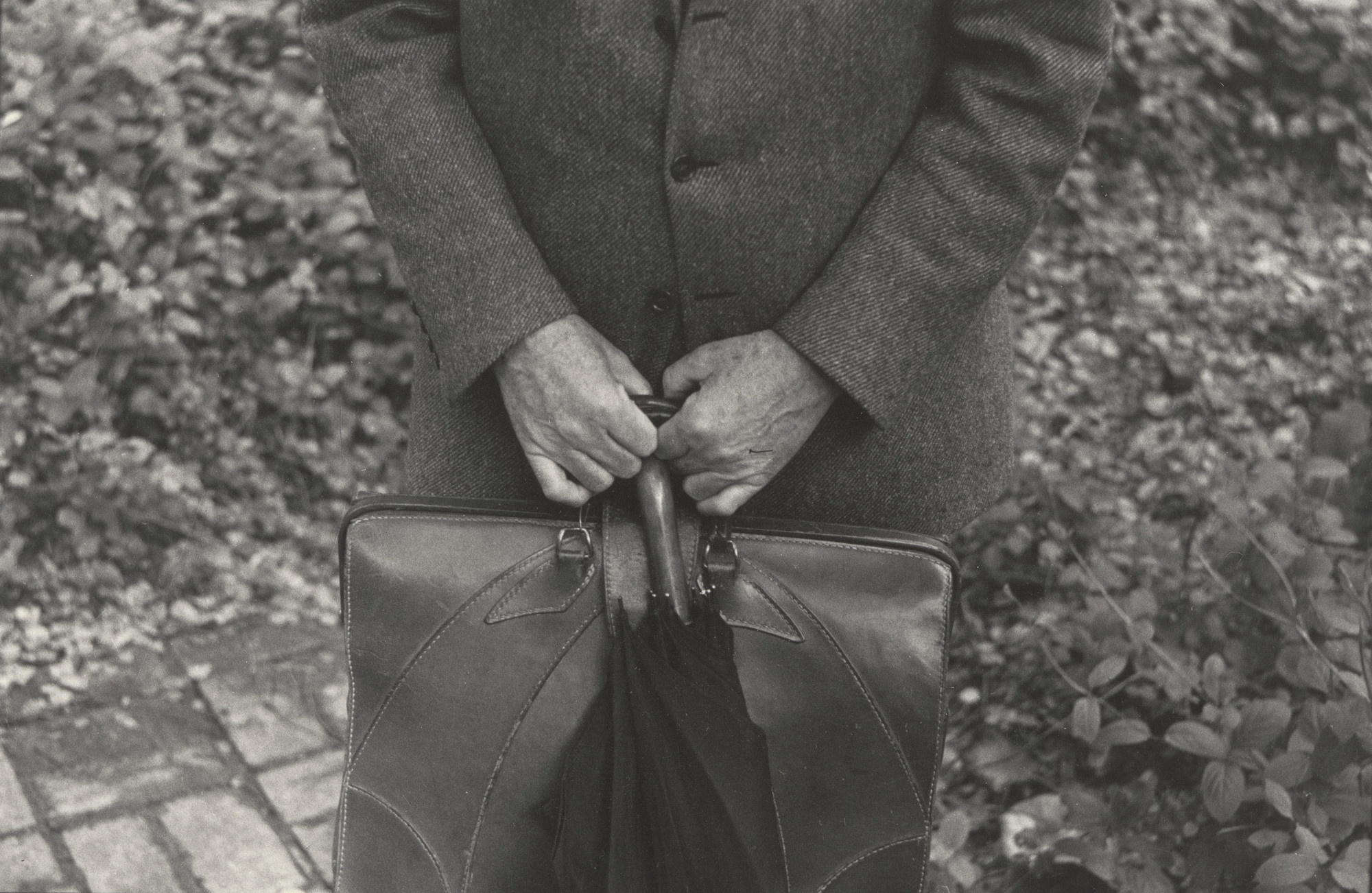 Dorothea Lange. Paul, Briefcase and Umbrella. 1957