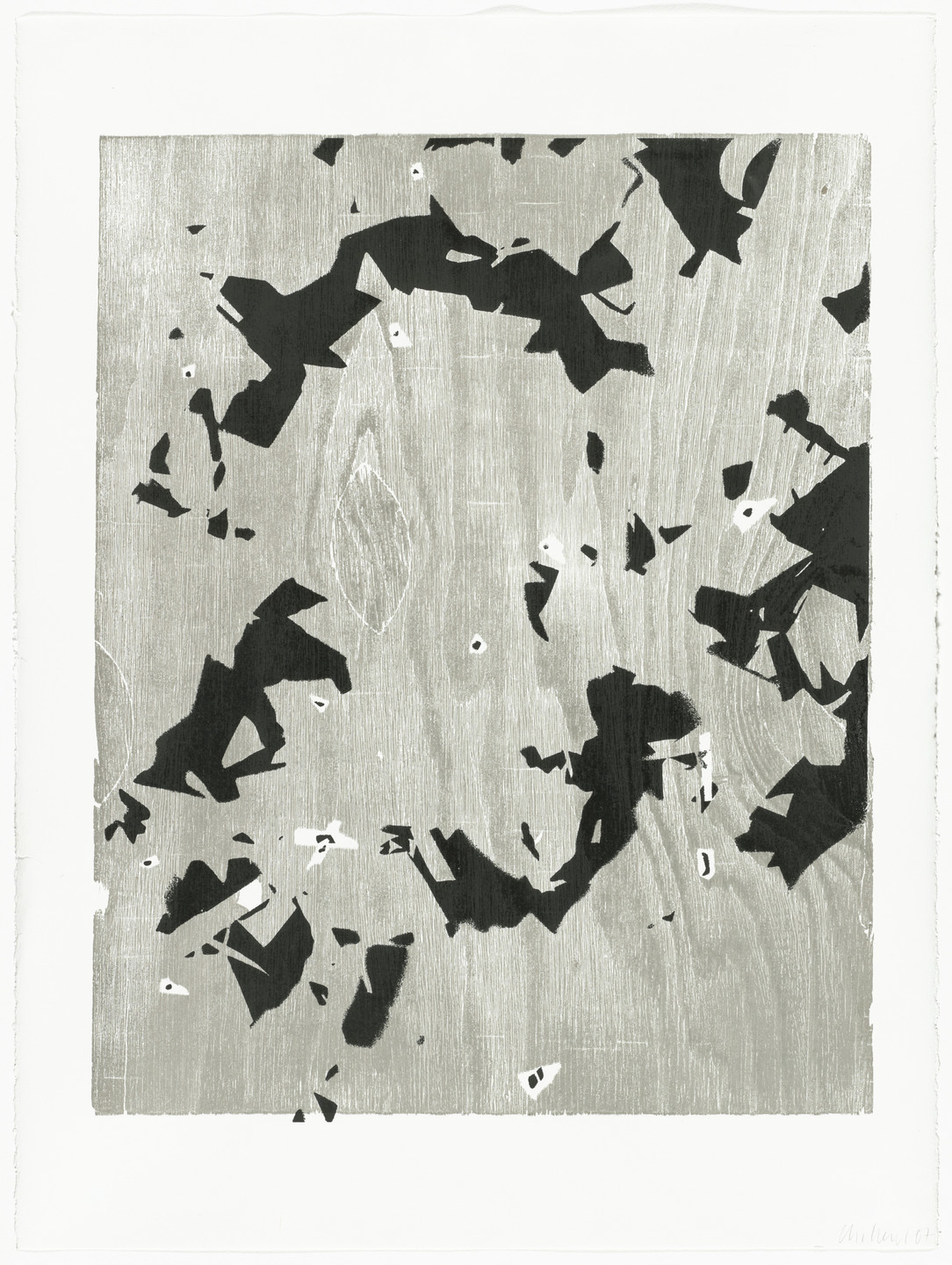 The image features a predominantly gray background with various irregular black shapes scattered across it. There are also small patches of white areas within and around the black shapes. This is an AI generated description. To give feedback, email ai@moma.org.
