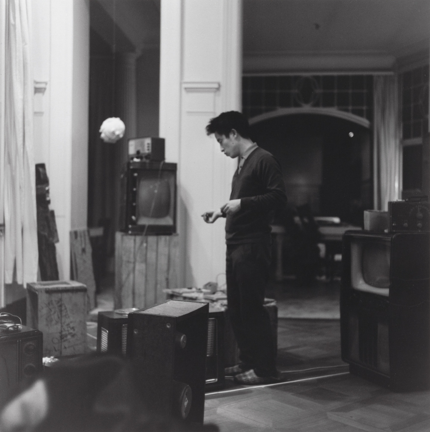 George Maciunas, Nam June Paik. Nam June Paik at his Exposition of Music – Electronic Television, Galerie Parnass, Wuppertal, March 11-20, 1963. 1963