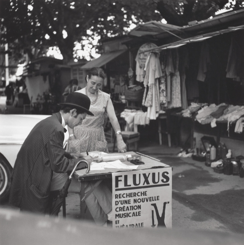 Signing certificates, performed during Fluxus Festival of Total Art and Comportment, Flea market, Nice, July 25, 1963