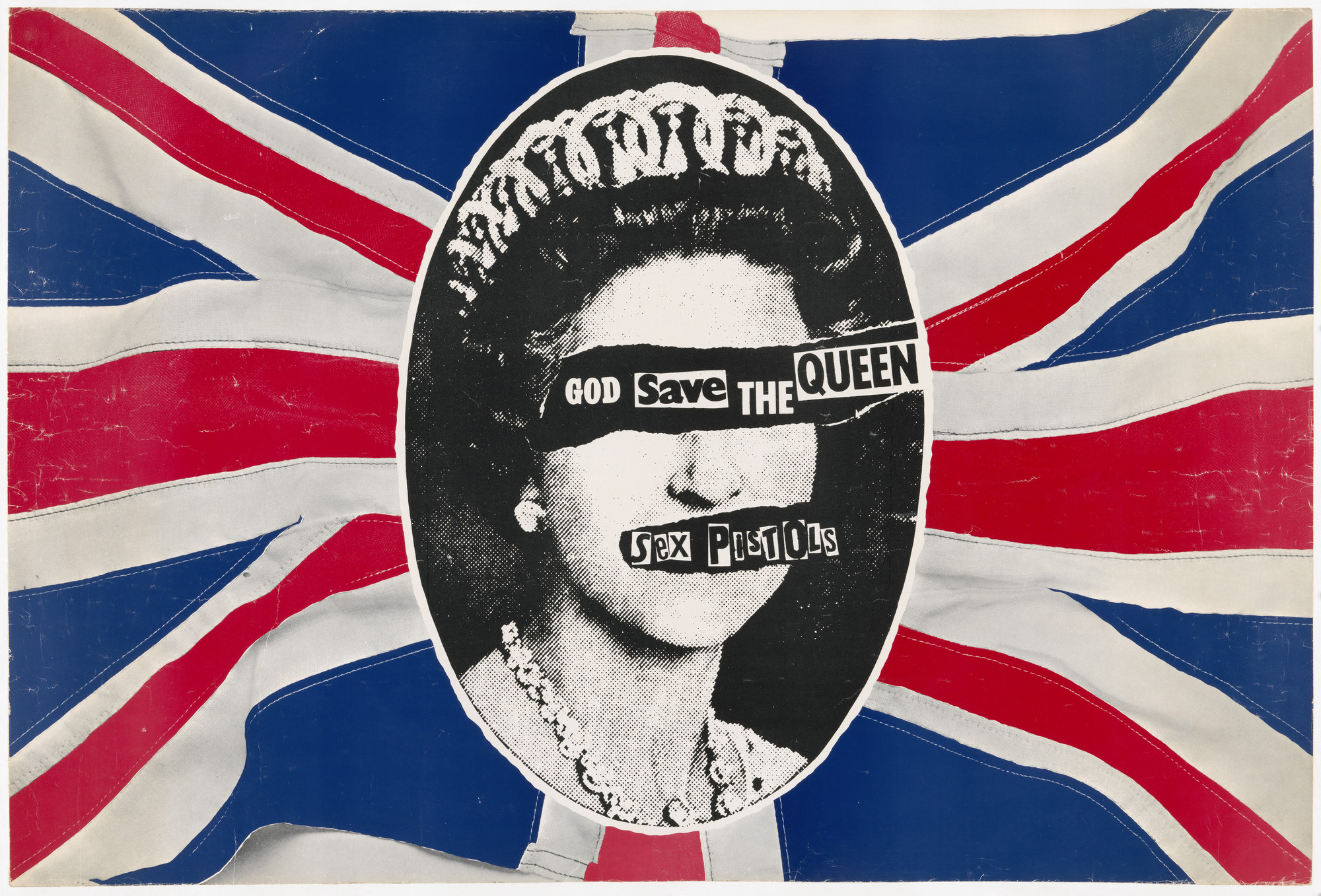 A black-and-white portrait with the eyes and mouth obscured by text is set against a weathered Union Jack flag with predominant colors of red, white, and blue. The text over the eyes reads &#34;God Save The Queen,&#34; and the text over the mouth reads &#34;Sex Pistols.&#34; This is an AI generated description. To give feedback, email ai@moma.org.