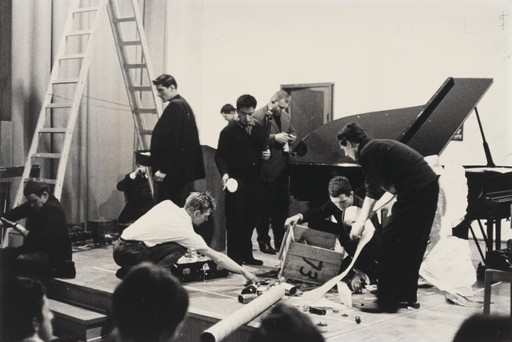 Reading Work Piece No. 1: music while you work, performed during Festum Fluxorum/Fluxus/Musik und Antimusik/Das Instrumentale Theater, Staatliche Kunstakademie, Düsseldorf, February 3, 1963