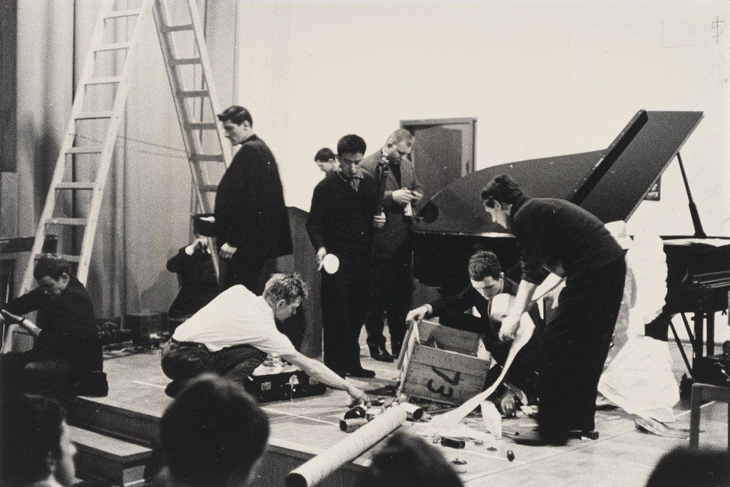Reading Work Piece No. 1: music while you work, performed during Festum Fluxorum/Fluxus/Musik und Antimusik/Das Instrumentale Theater, Staatliche Kunstakademie, Düsseldorf, February 3, 1963, Arthur Köpcke, 1962, performed 1963