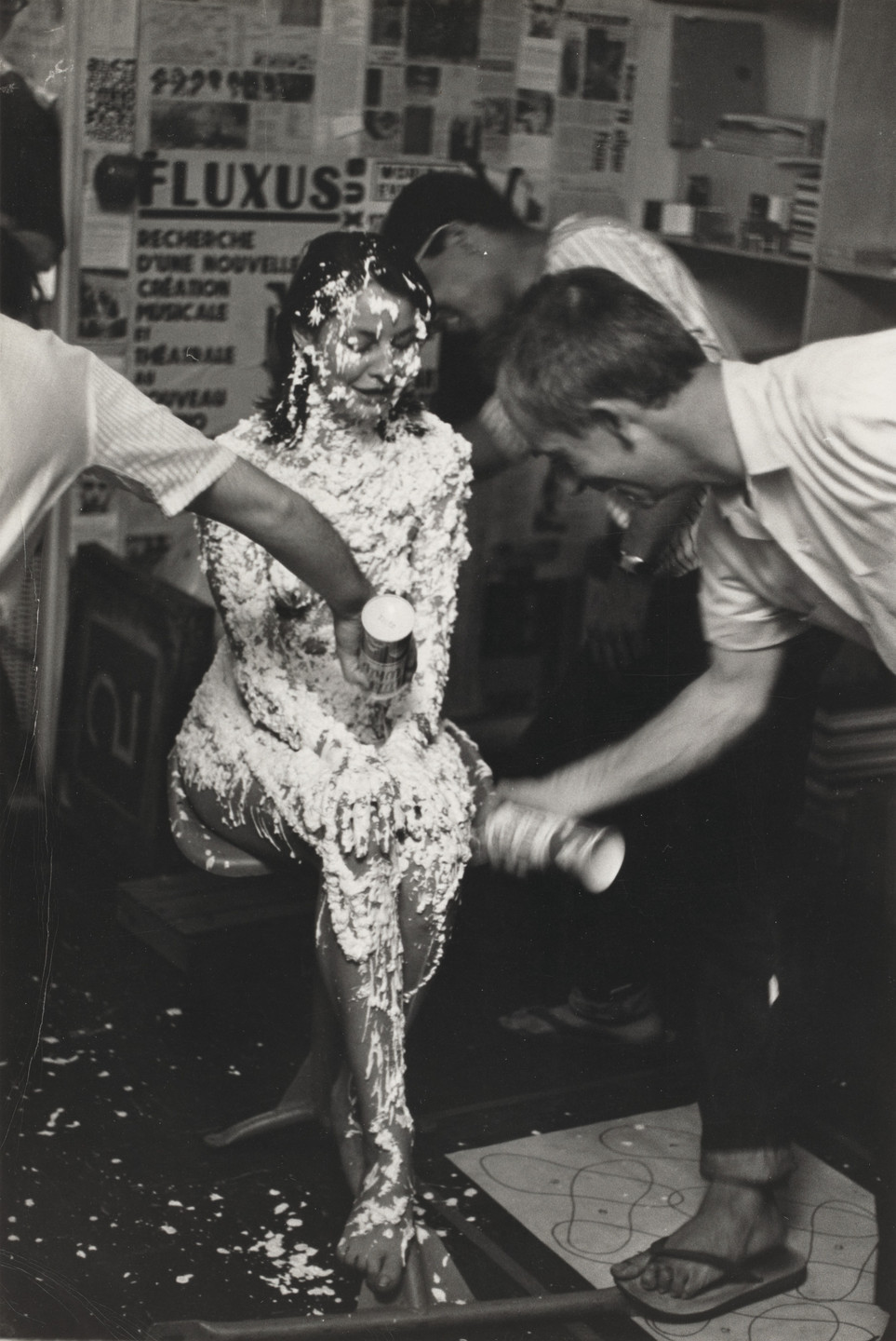Benjamin Patterson, Peter Moore. Lick Piece (1962), performed by Lette Eisenhauer during Fully Guaranteed 12 Fluxus Concerts, Canal Street, New York, May 9, 1964. 1964