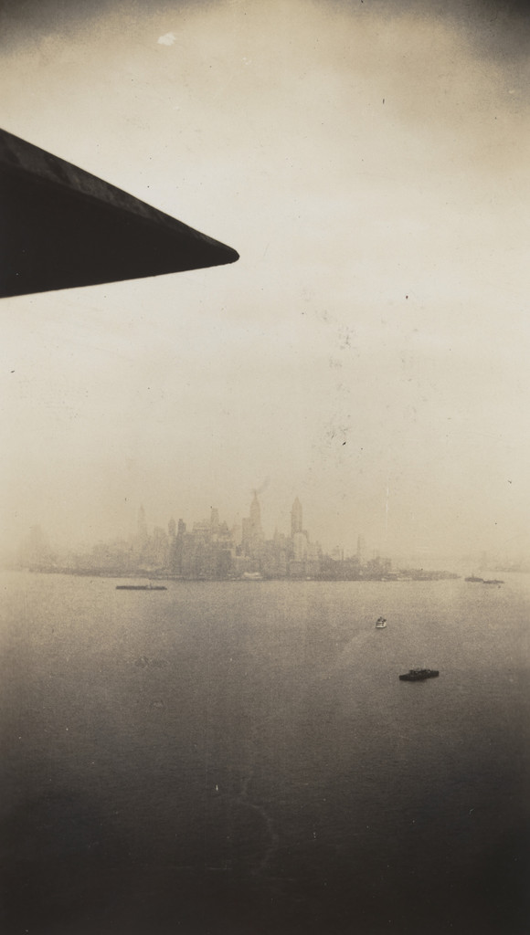 Untitled, (View of skyline, airplane wing tip)