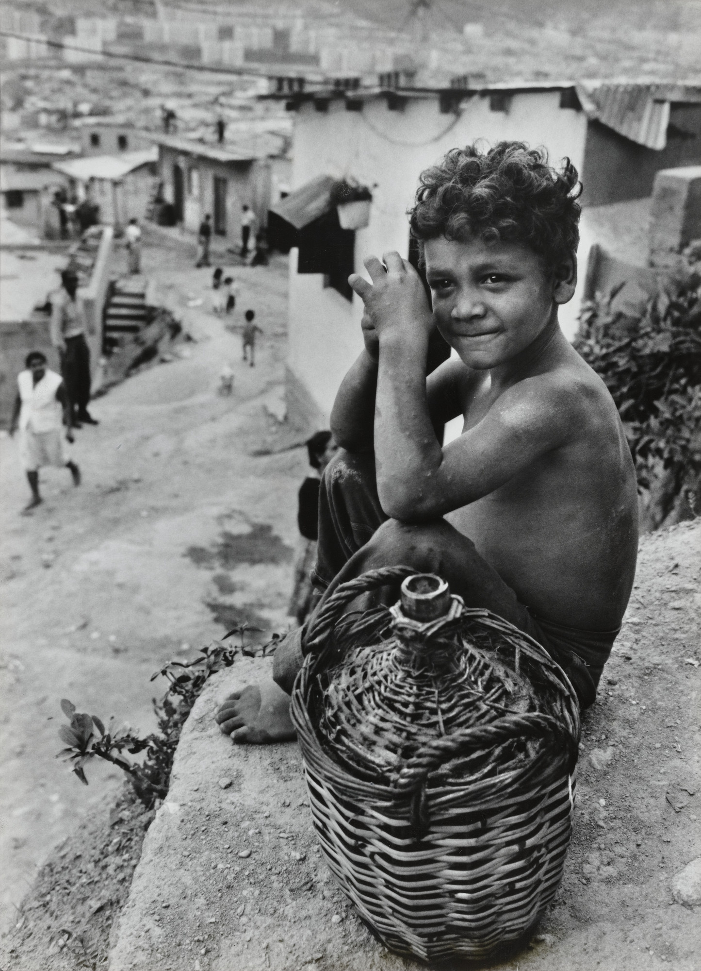 Ken Heyman. Boy on hillside overlooking Caracas, Venezuela. 1962