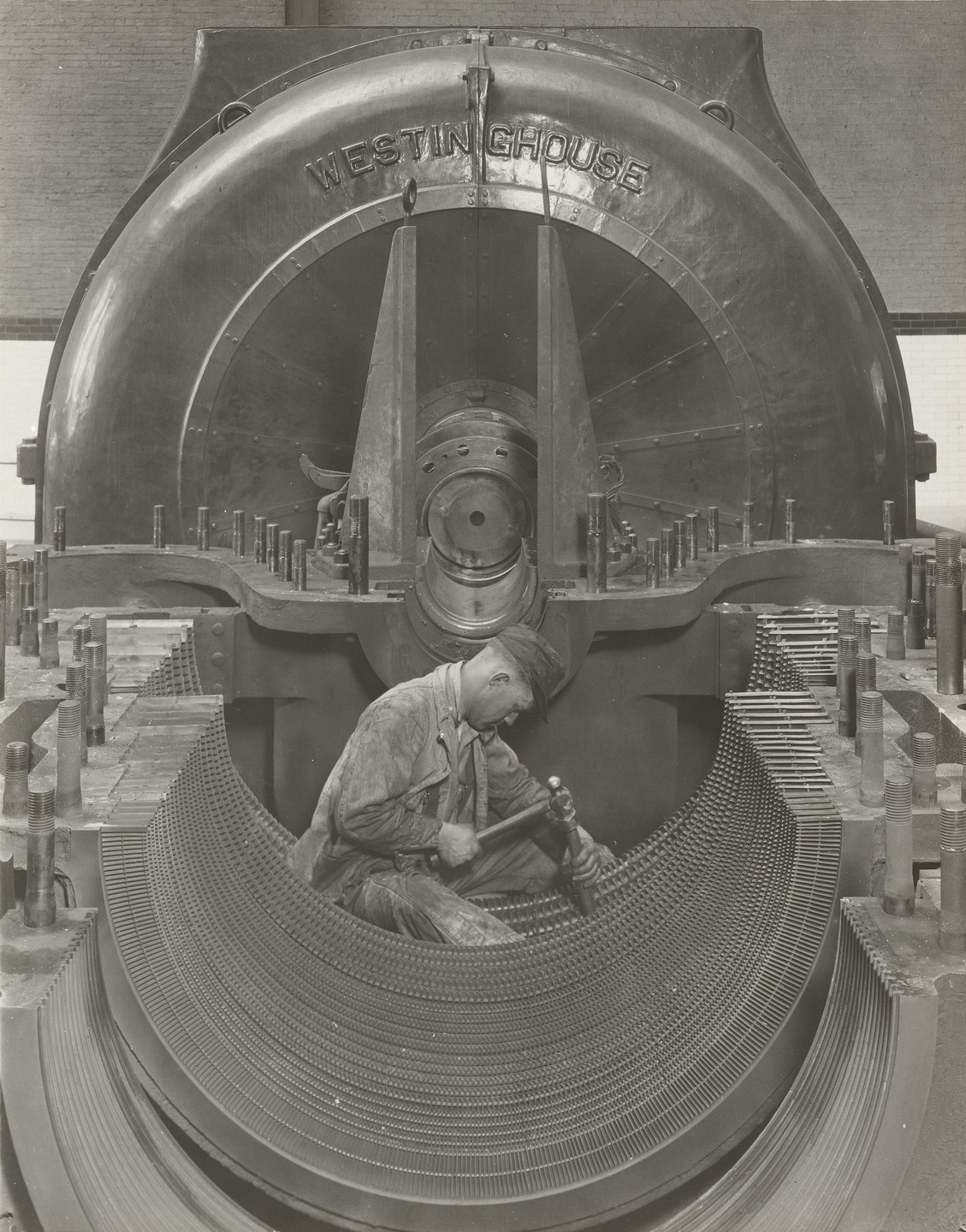 Lewis Wickes Hine. A Worker in his Shrine--The Heart of the Turbine. 1920