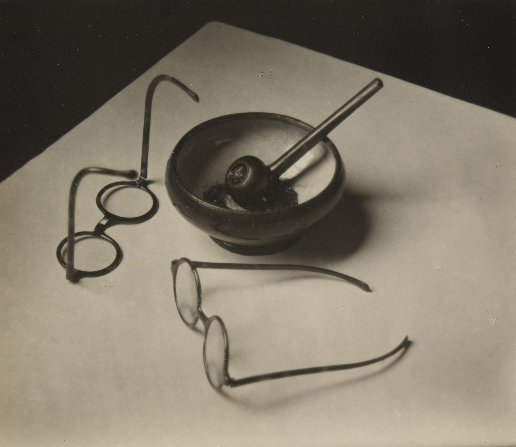 André Kertész. Mondrian&#39;s Glasses and Pipe. 1926