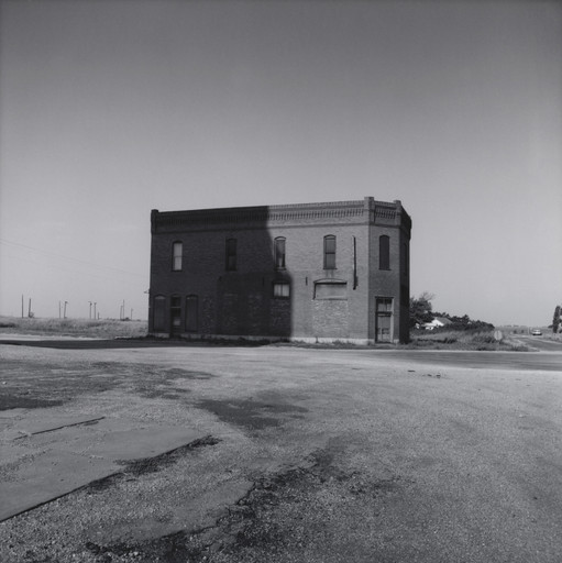 Brick Building in the Shadow of a Grain Elevator - Cashion, Oklahoma