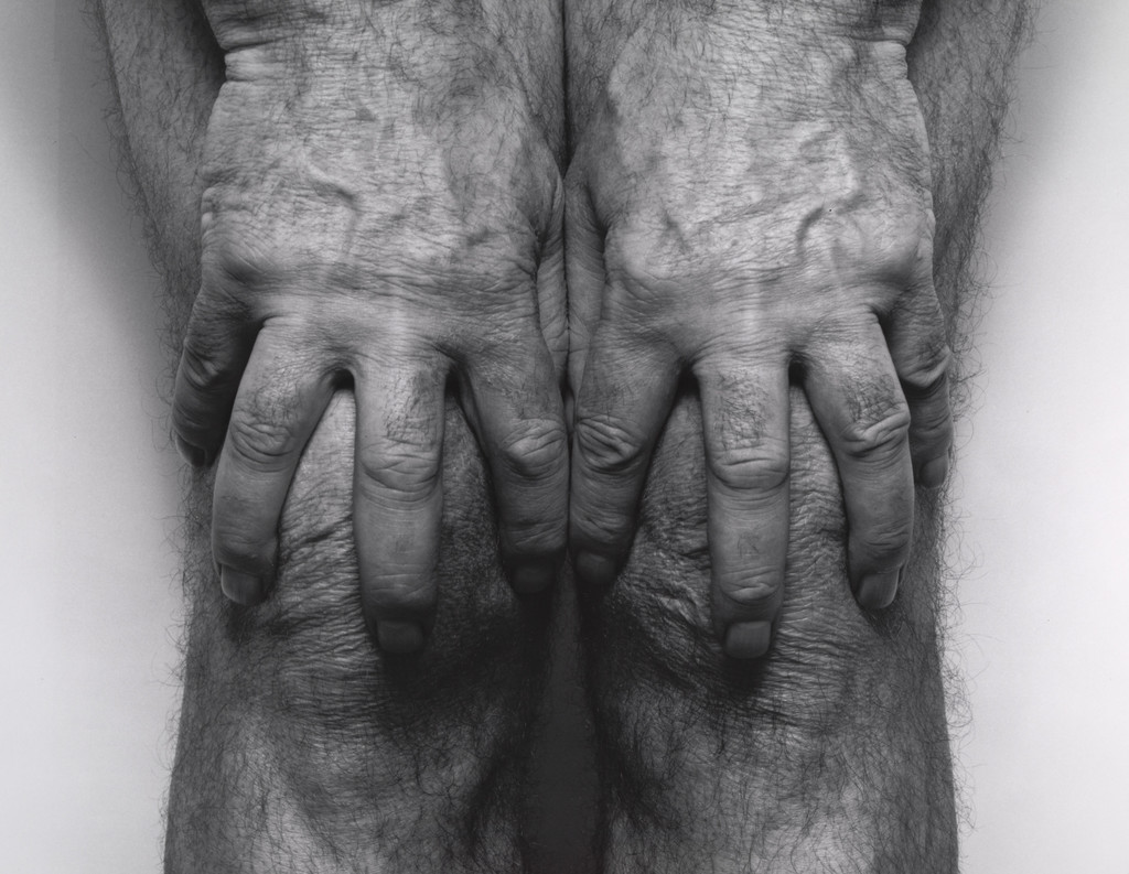 Hands Spread on Knees