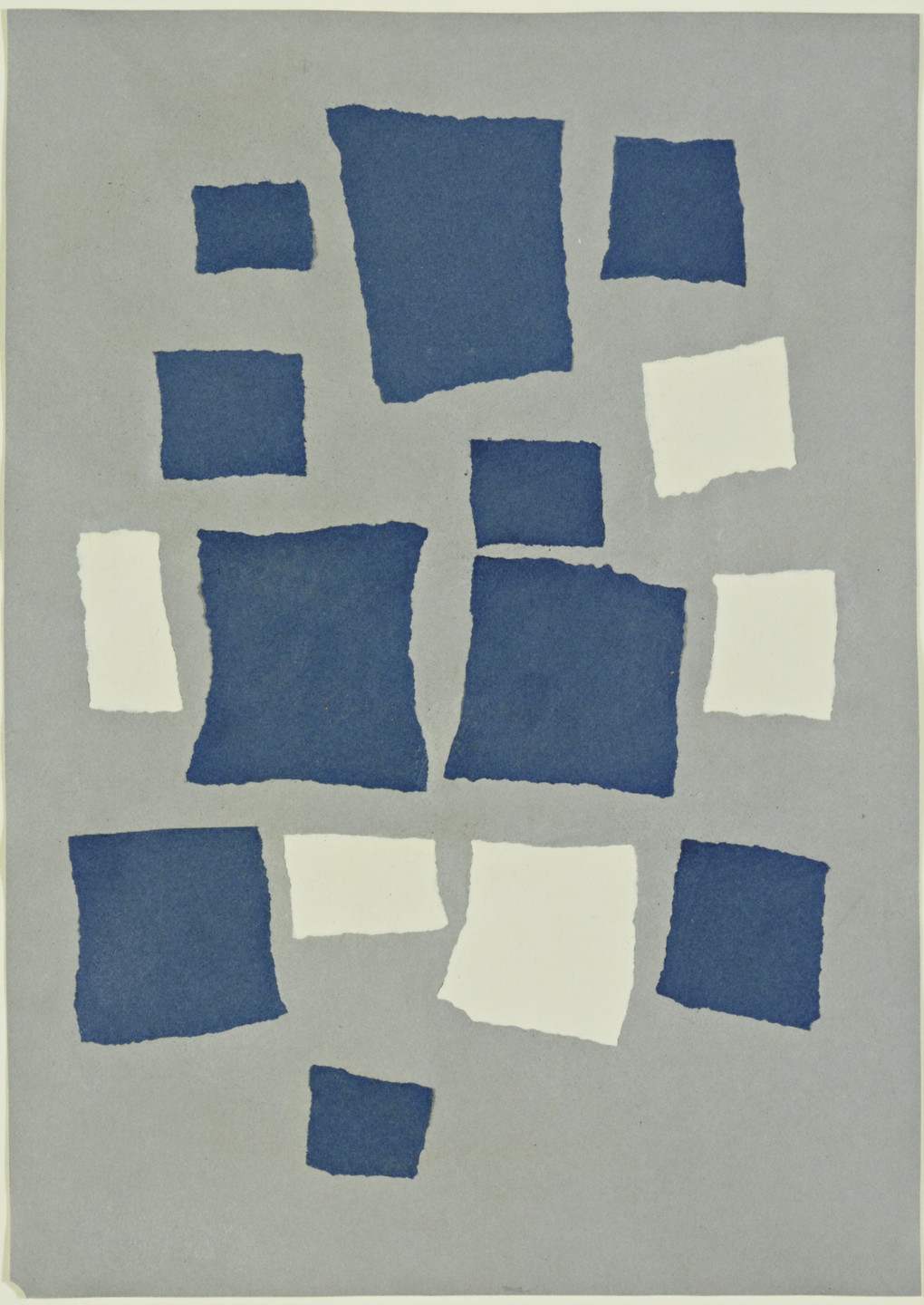 The image shows a collage of uneven blue and white torn paper rectangles arranged randomly on a light grey background. There are 10 blue rectangles and 5 white rectangles. This is an AI generated description. To give feedback, email ai@moma.org.
