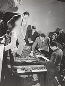 Philip Corner, Emmett Williams, George Maciunas, Benjamin Patterson, Dick Higgins, Alison Knowles. Philip Corner&#39;s Piano Activities, performed by Philip Corner, George Maciunas, Emmett Williams, Benjamin Patterson, Dick Higgins, and Alison Knowles during Fluxus Internationale Festpiele Neuester Musik, Hörsaal des Städtischen Museums, Wiesbaden, Germany, September 1, 1962. 1962