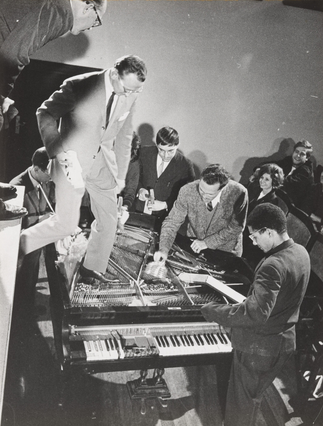 Philip Corner, Emmett Williams, George Maciunas, Benjamin Patterson, Dick Higgins, Alison Knowles. Philip Corner&#39;s Piano Activities, performed by Philip Corner, George Maciunas, Emmett Williams, Benjamin Patterson, Dick Higgins, and Alison Knowles during Fluxus Internationale Festpiele Neuester Musik, Hörsaal des Städtischen Museums, Wiesbaden, Germany, September 1, 1962. 1962