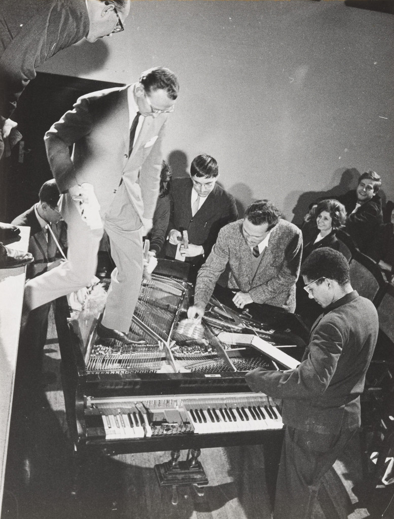 Philip Corner's Piano Activities, performed by Philip Corner, George Maciunas, Emmett Williams, Benjamin Patterson, Dick Higgins, and Alison Knowles during Fluxus Internationale Festspiele Neuester Musik, Hörsaal des Städtischen Museums, Wiesbaden, Germany, September 1, 1962