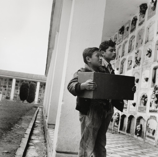 Two boys with a box of their grandmother's bones, Bogota, Colombia