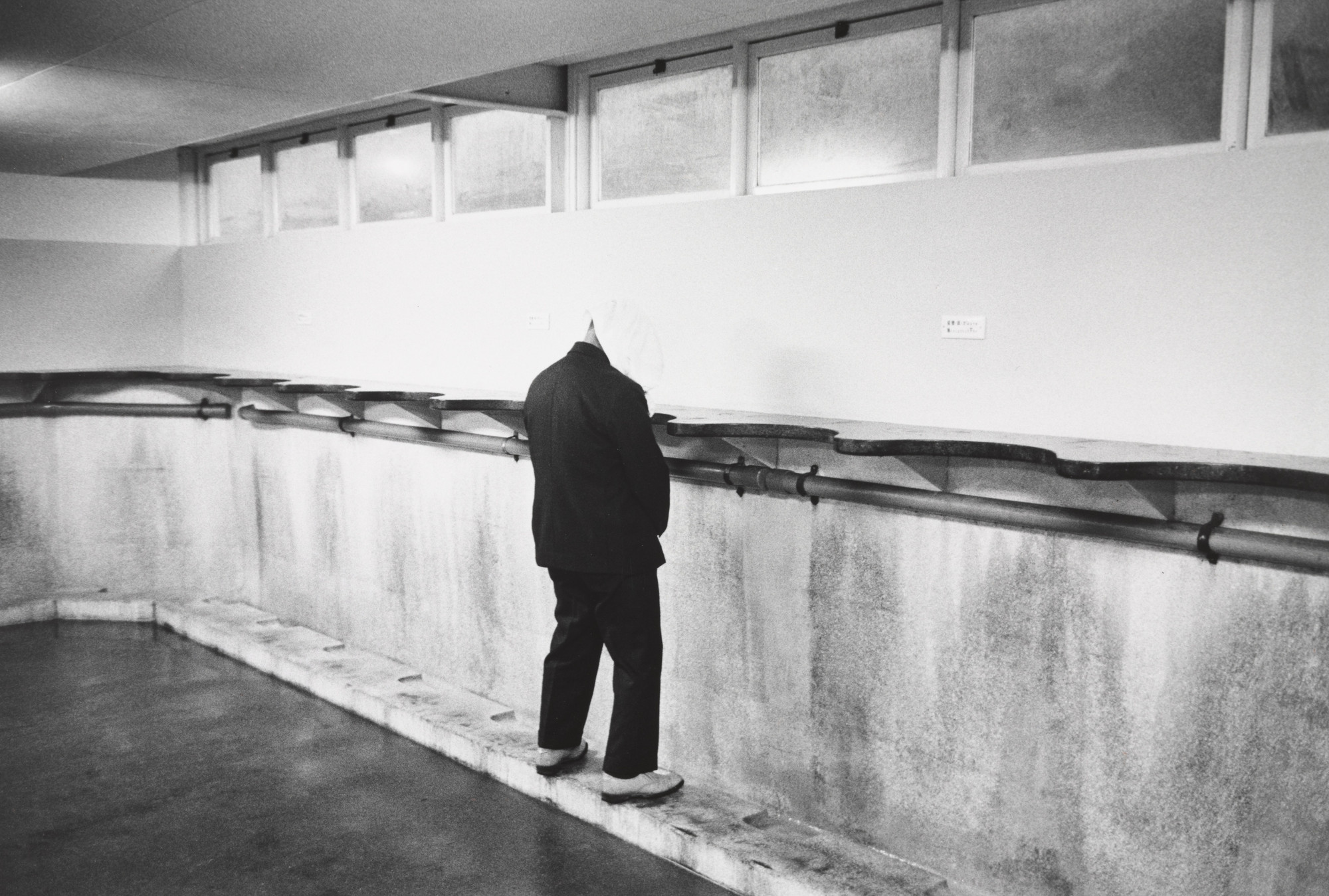 Ryoji Akiyama. Men Using a Toilet Along National Highway 2. 1970